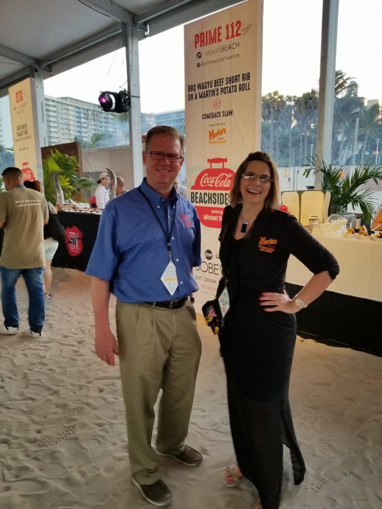 Todd Bixby, Martin’s Director of Sales Operations; and Wendy Cowan, Martin’s Marketing Manager at the SOBEWFF® Coca-Cola Beachside BBQ hosted by Michael Symon event