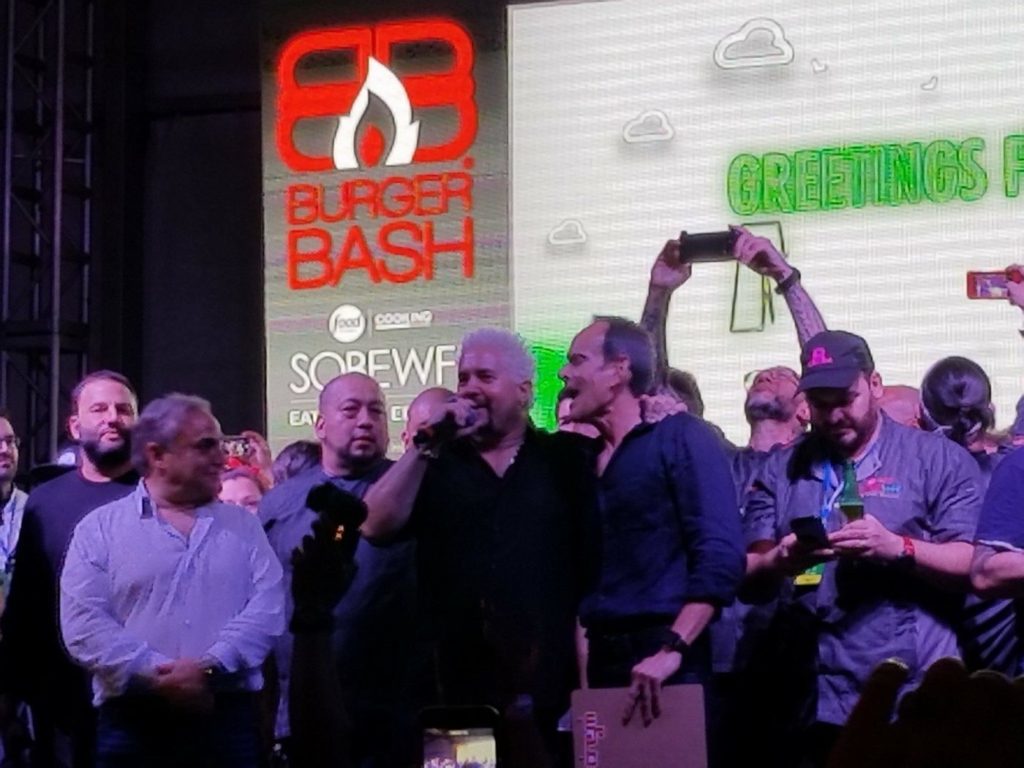 Celebrity Chef Guy Fieri (center) announcing the winning burgers of the 2018 SOBEWFF® Burger Bash®
