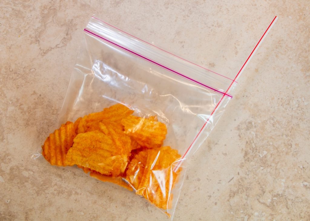 Lunchbox Hack 2; Bag of chips with straw inserted