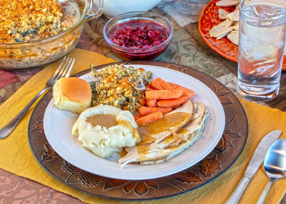 Thanksgiving Plate with Green Bean Casserole, Turkey, Mashed Potatoes, Gravy, Dinner Roll, Roasted Carrots, Cranberry Sauce