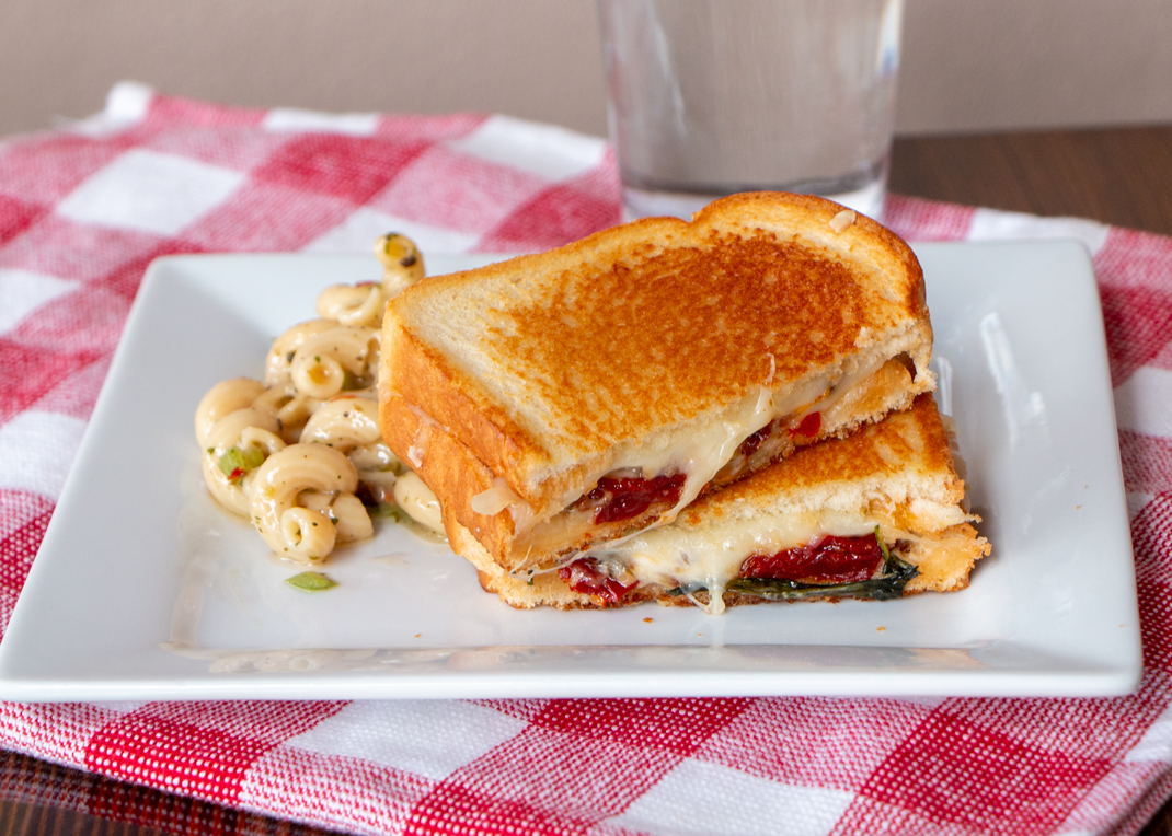 Gruyére, Sundried Tomatoes, Roasted Garlic Aioli, and Basil Grilled Cheese on Martin’s Butter Bread